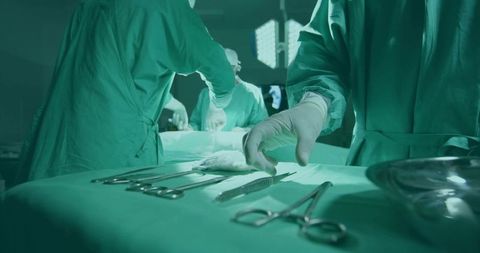 Surgical Team Performing Medical Operation in Operating Room