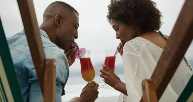 Romantic Couple Enjoying Cocktails at Beach - Download Free Stock Images Pikwizard.com