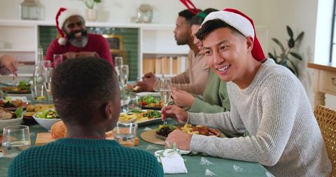 Diverse Family Celebrating Holiday Meal with Joy and Togetherness