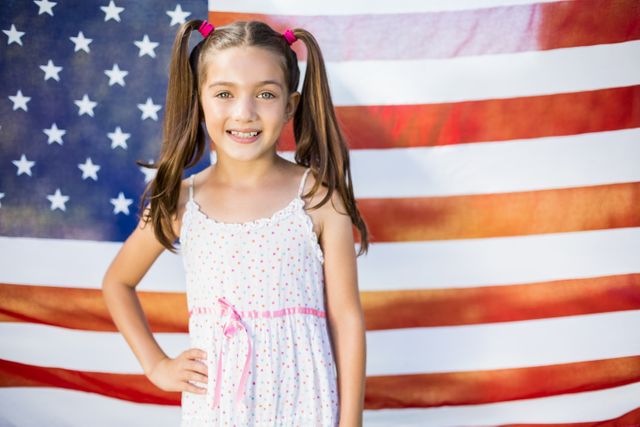 Smiling Young Girl in Front of American Flag - Download Free Stock Photos Pikwizard.com