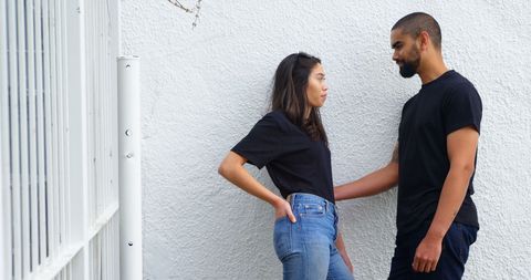 Happy Couple Smiling on Urban Sidewalk