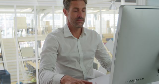 Businessman Meditating at Desk in Modern Office - Download Free Stock Images Pikwizard.com