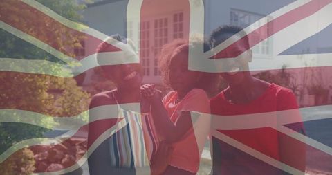 Happy family celebrating in british neighborhood