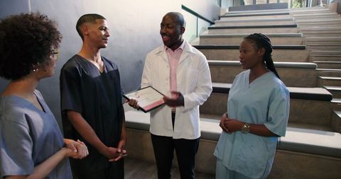 Team celebrates doctor's achievement in healthcare facility