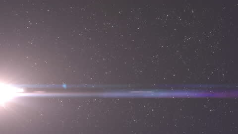 Blazing Light Rays Against Star-Studded Night Sky