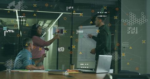 Diverse Business Team Brainstorming Ideas on Glass Wall