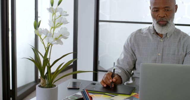 Mature African American Man Working on Laptop in Modern Office - Download Free Stock Images Pikwizard.com