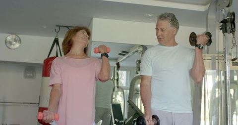 Senior Couple Lifting Dumbbells, Embracing Fitness Lifestyle