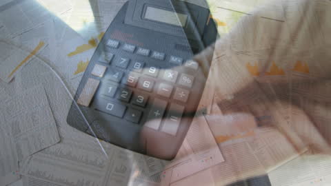 Double Exposure of Calculator and Hand with Financial Reports