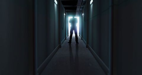 Silhouette in Dark Corridor Creating Mysterious Ambiance - Download Free Stock Images Pikwizard.com