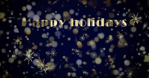 Golden happy holidays lettering with starburst glitter and bokeh on navy background