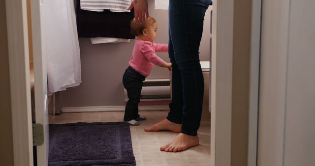 Mother Helping Toddler Stand in Cozy Bathroom - Download Free Stock Images Pikwizard.com