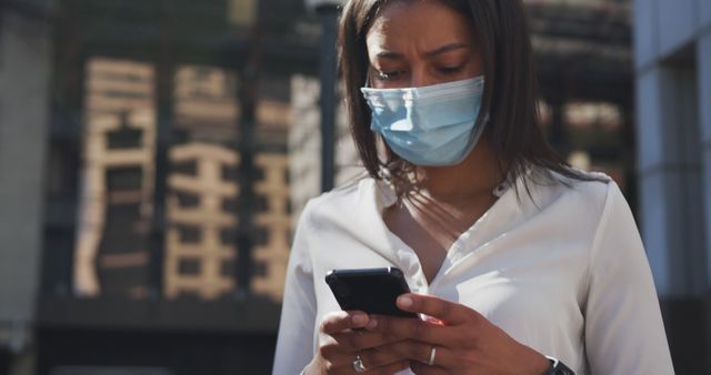 Woman in Mask Using Smartphone in Urban Area - Download Free Stock Images Pikwizard.com