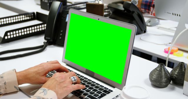 Professional Typing on Laptop with Green Screen at Office Desk - Download Free Stock Images Pikwizard.com