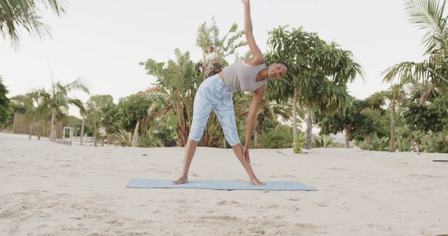 Woman Practicing Outdoor Yoga on Sandy Beach - Download Free Stock Images Pikwizard.com