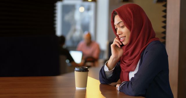 Muslim Woman in Hijab Talking on Phone at Cafe - Download Free Stock Images Pikwizard.com