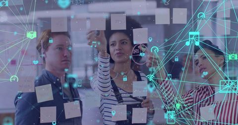 Diverse team collaborating in high-tech, interactive office
