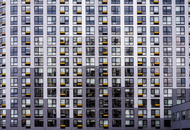 Modern Urban Apartment Building With Grid-Patterned Windows - Download Free Stock Images Pikwizard.com