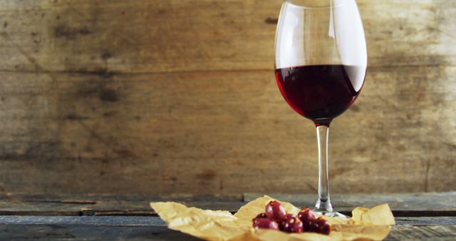 Glass of Red Wine with Grapes on Rustic Wooden Background - Download Free Stock Images Pikwizard.com