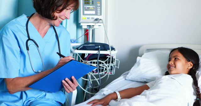 Nurse Providing Care to Young Girl in Hospital Bed Smiling Together - Download Free Stock Images Pikwizard.com