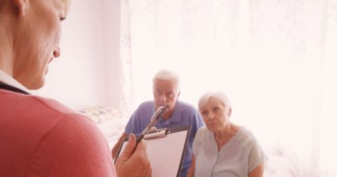 Healthcare Consultation with Senior Couple in Clinic Room