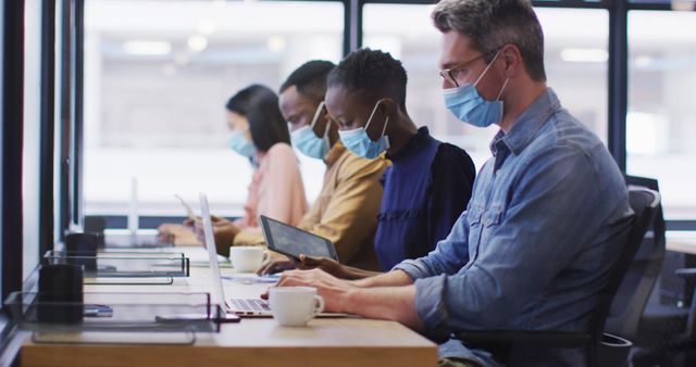 Office Workers Using Laptops and Tablets While Wearing Face Masks - Download Free Stock Images Pikwizard.com