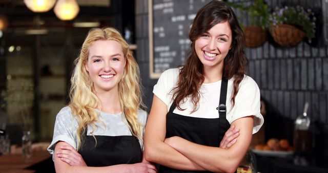 Smiling Baristas in Cafe with Arms Crossed - Download Free Stock Images Pikwizard.com