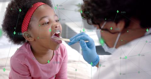 African American Doctor Examining Young Patient