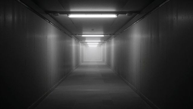 Endless industrial corridor with bright haze