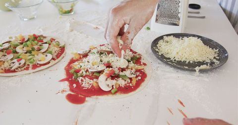 Hands Preparing Homemade Pizza with Fresh Ingredients - Download Free Stock Images Pikwizard.com