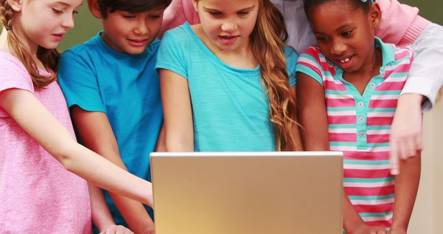 Diverse Group of Kids Engaging in Learning Activity on Laptop - Download Free Stock Images Pikwizard.com