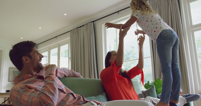 Happy Family Playing Together in Living Room with Large Windows - Download Free Stock Images Pikwizard.com