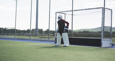 Field hockey goalie equipped and focused before match