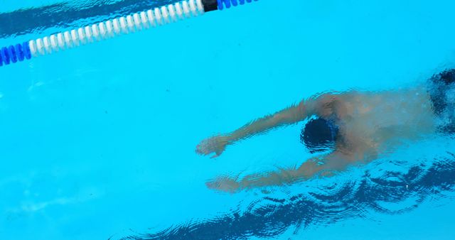 Swimmer Making Long Stroke in Blue Pool Water - Download Free Stock Images Pikwizard.com