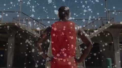 Man in Red Shirt Overlooking Future City Construction