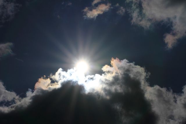 Low Angle View of Sun Shining Through Clouds - Download Free Stock Photos Pikwizard.com
