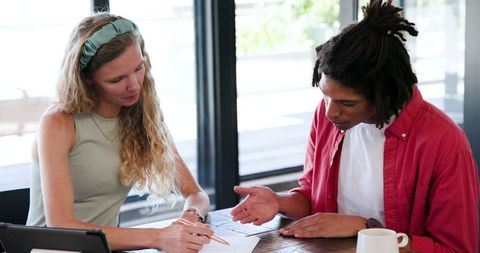 Colleagues Collaborating on Project Ideas in Office Meeting