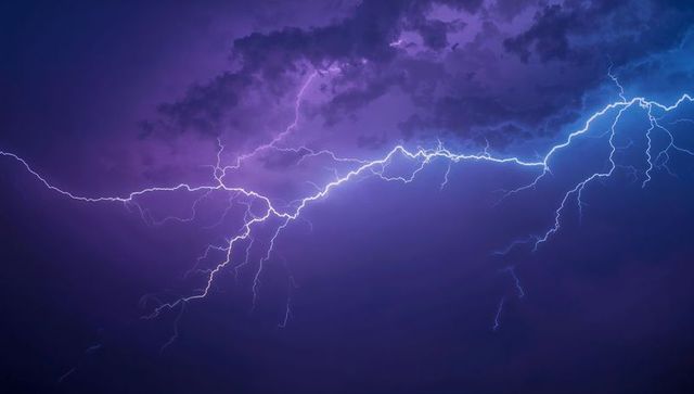 Spectacular Purple Storm Lightning Display in Cloudy Night Sky
