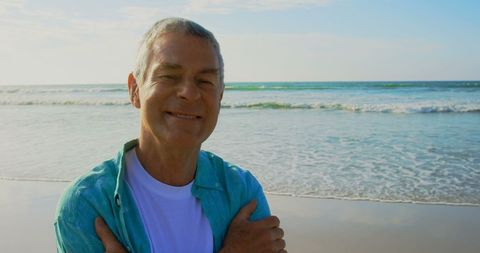 Smiling Senior Man Enjoying Peaceful Beach Moment - Download Free Stock Images Pikwizard.com
