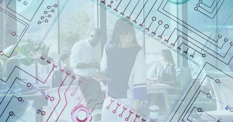 Diverse professionals collaborating on tech innovations in modern office