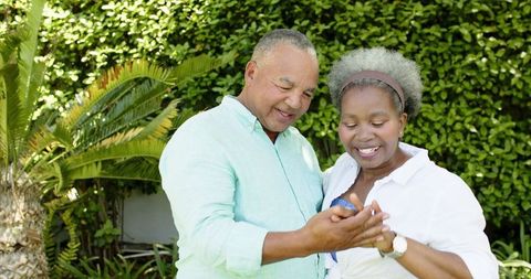 Senior Couple Engagement in Lush Garden