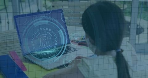 Child using laptop with fingerprint biometric interface securing remote learning
