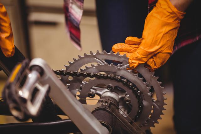 Mechanic Repairing Bicycle Gear System in Workshop - Download Free Stock Photos Pikwizard.com