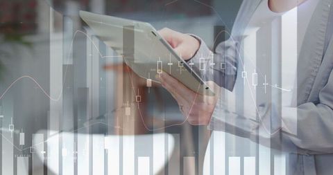 Businesswoman analyzing financial data on digital tablet with graph overlay