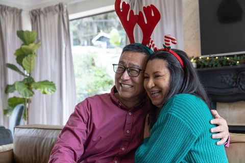 Senior couple enjoying festive holiday moment at home