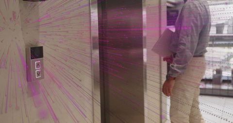 Office Worker Standing by Elevator Investigating Business Opportunities