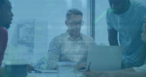 Collaborative Team Analysis with Digital Data Visuals in Modern Office