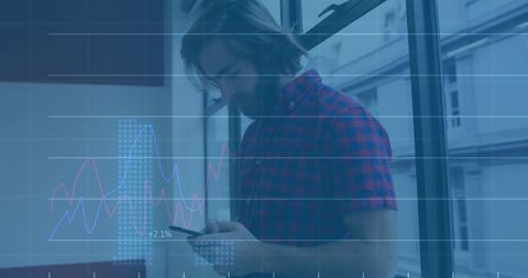 Businessman Analyzing Data on Smartphone with Digital Graph Overlay