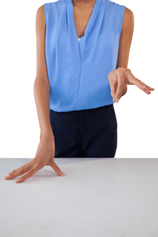 Transparent businesswoman hand gesture over table surface