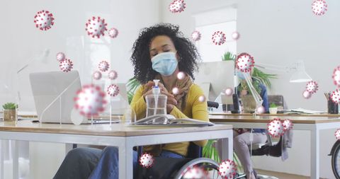 Office Workers with Masks and Sanitizer Working During Pandemic